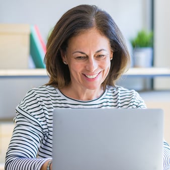 woman on laptop smiling