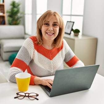 woman on laptop striped sweater_2121117050