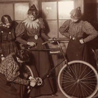 women repairing bicycle c1895